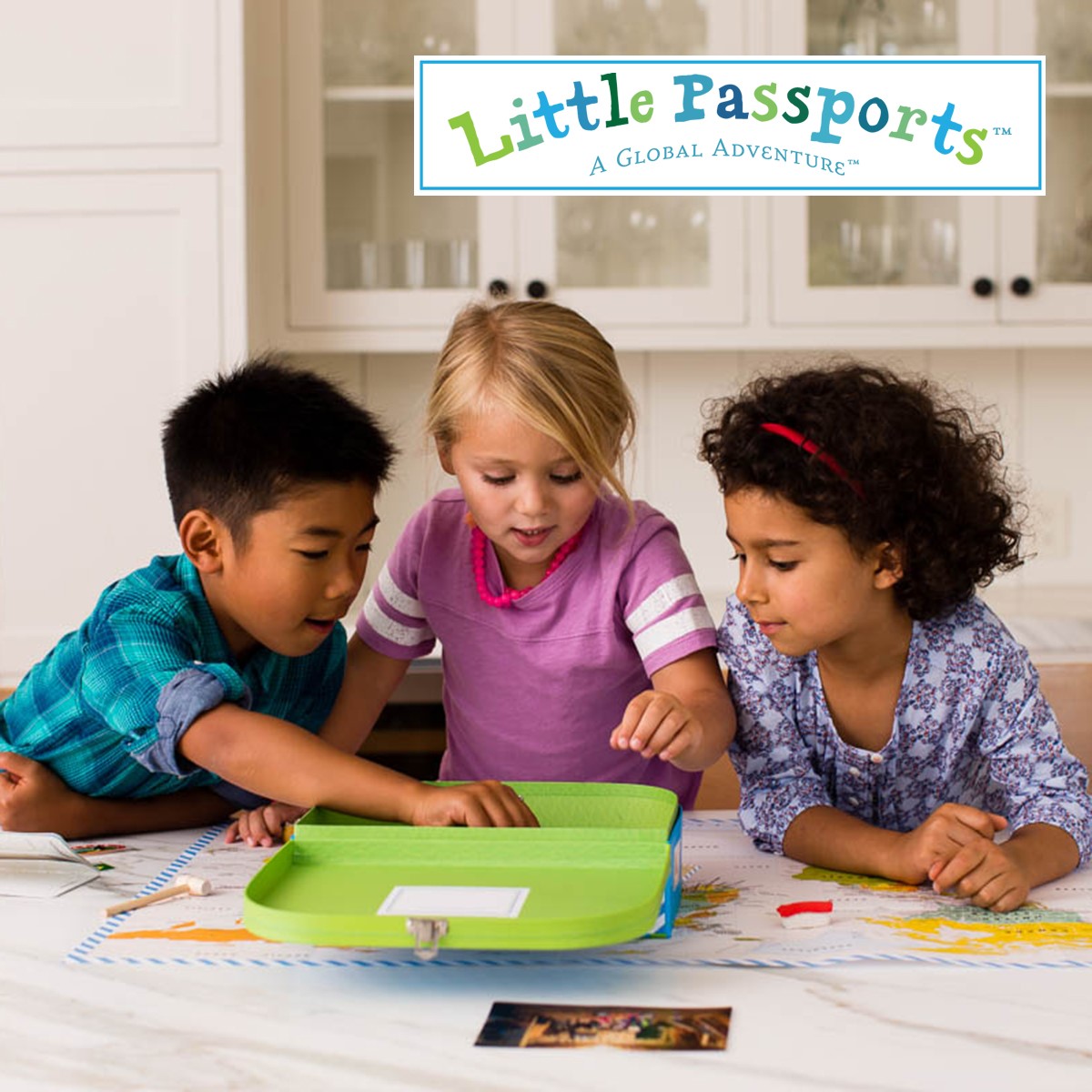 Three kids playing with little passports