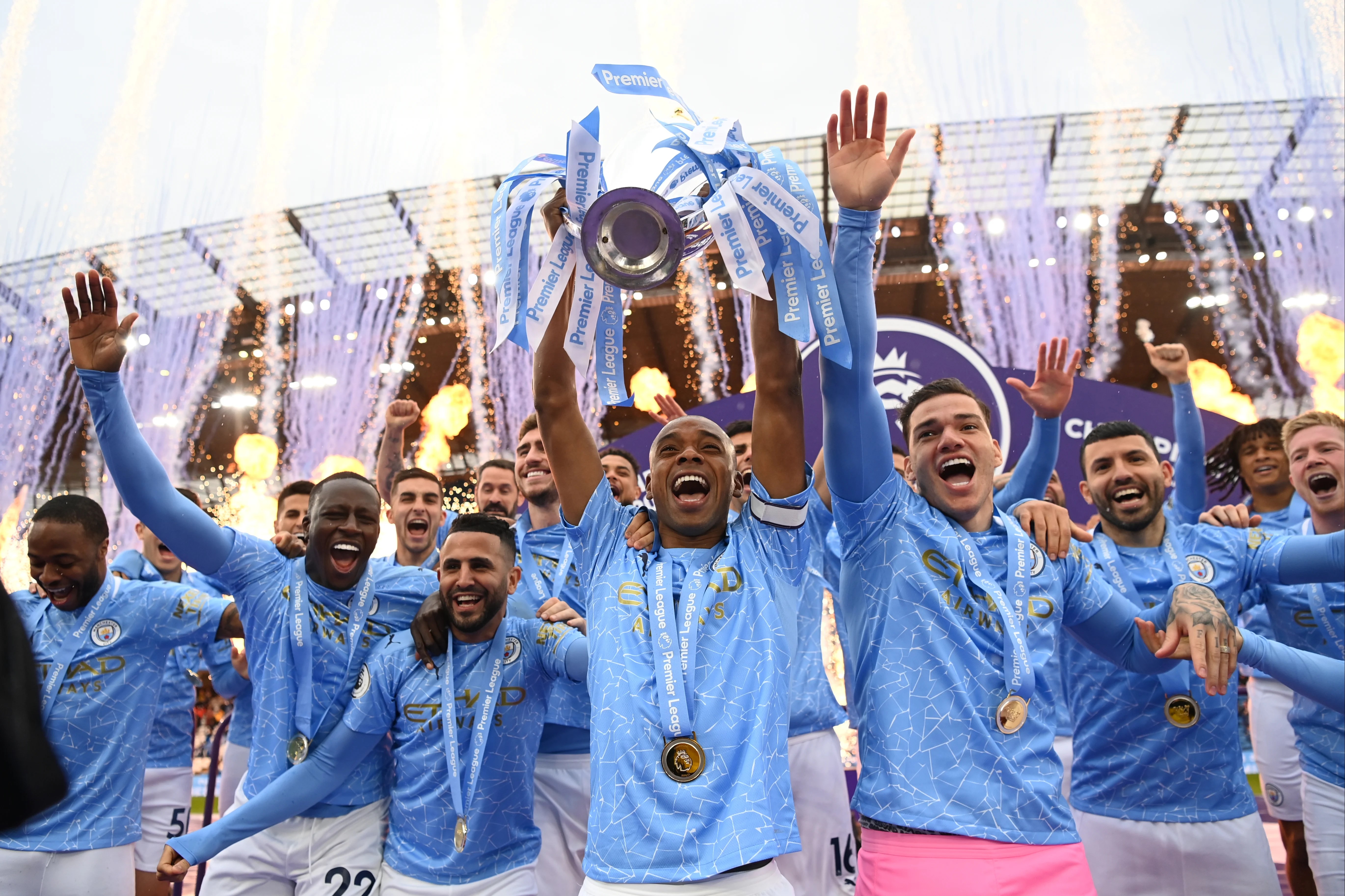 Man City lift the Premier League trophy as Sergio Aguero