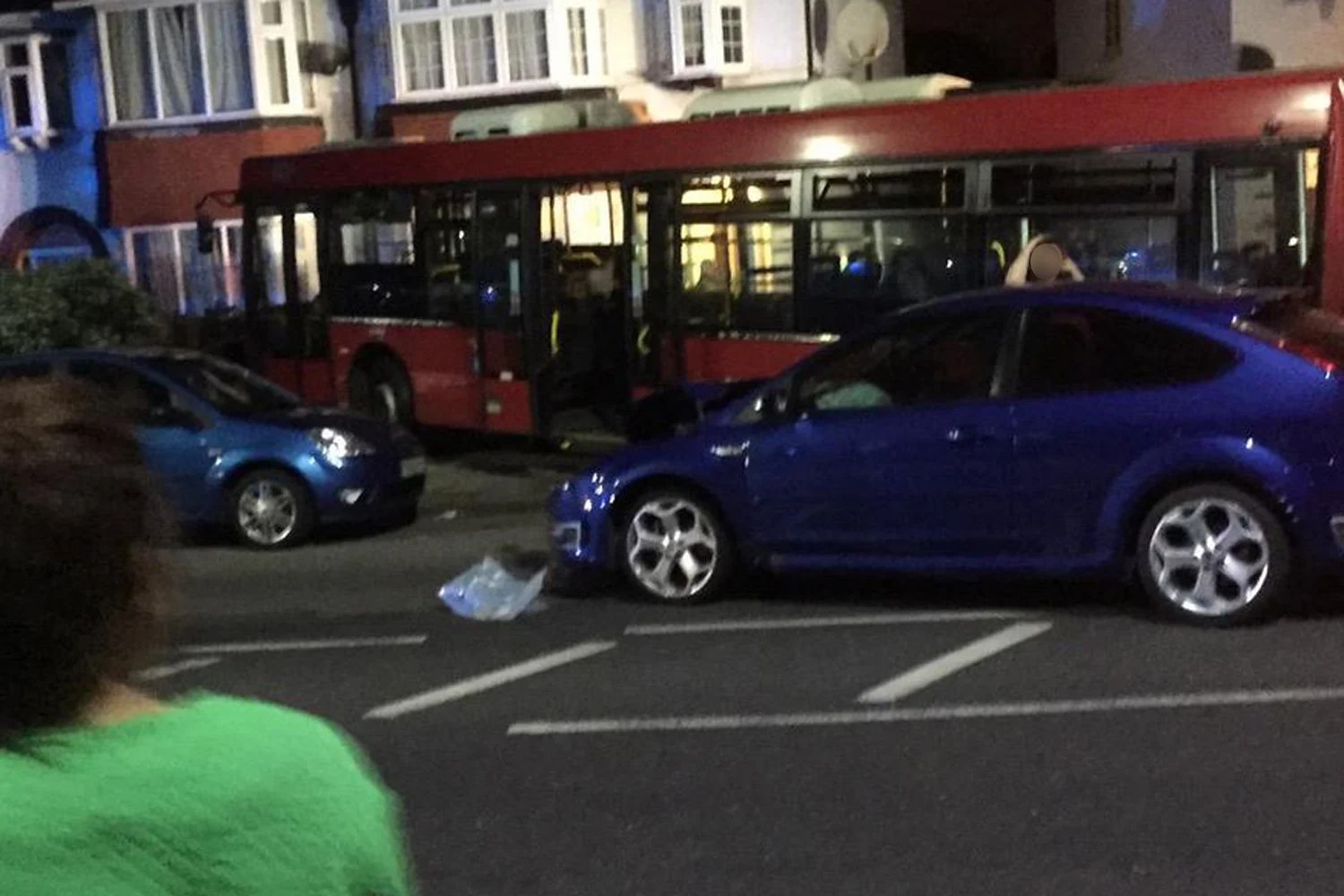 Bus ploughs into suburban front garden after crash in Beckenham
