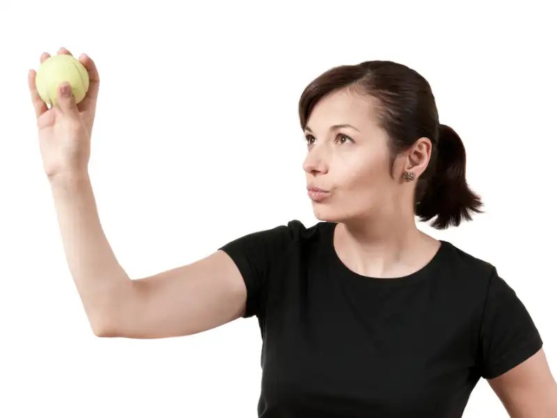 Squeeze the tennis ball with your chin
