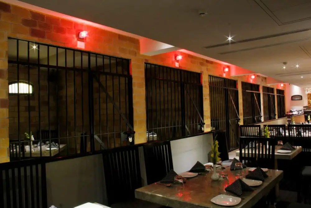 A restaurant where jailers take food order, prisoners serve the food