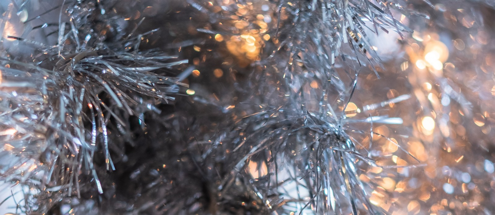 Tinsel was originally made from very thin strands of which metal?