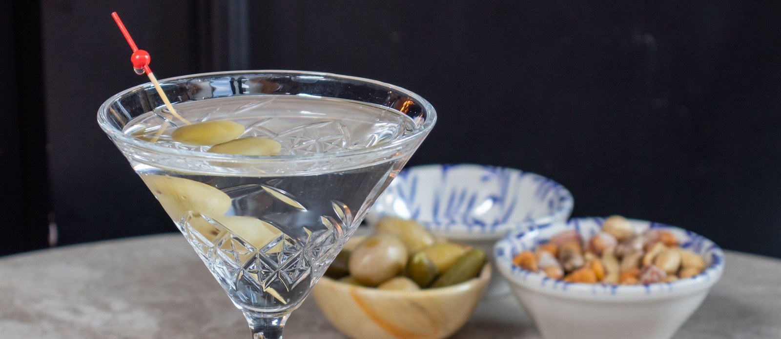 What fortified wine is added to gin or vodka to make a dry martini?