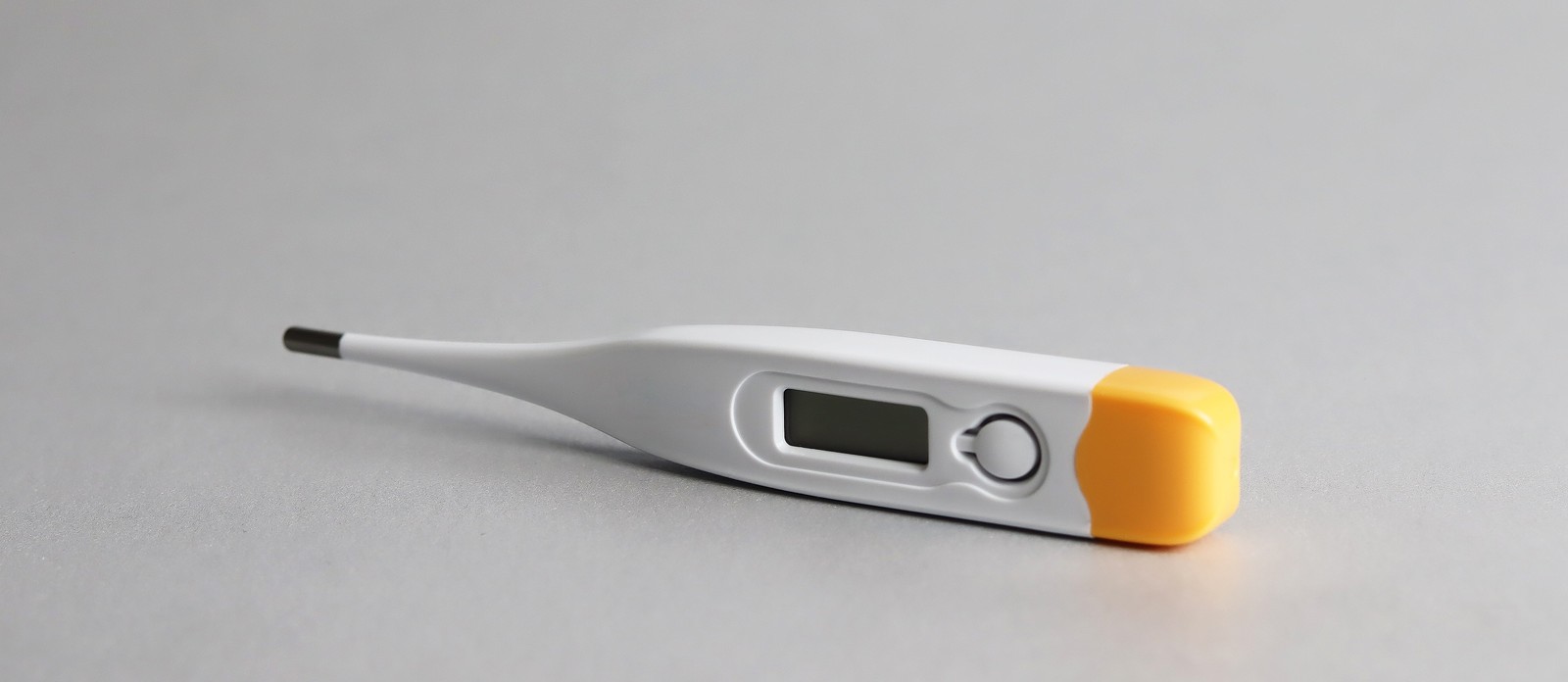 Where is the axillary temperature taken?