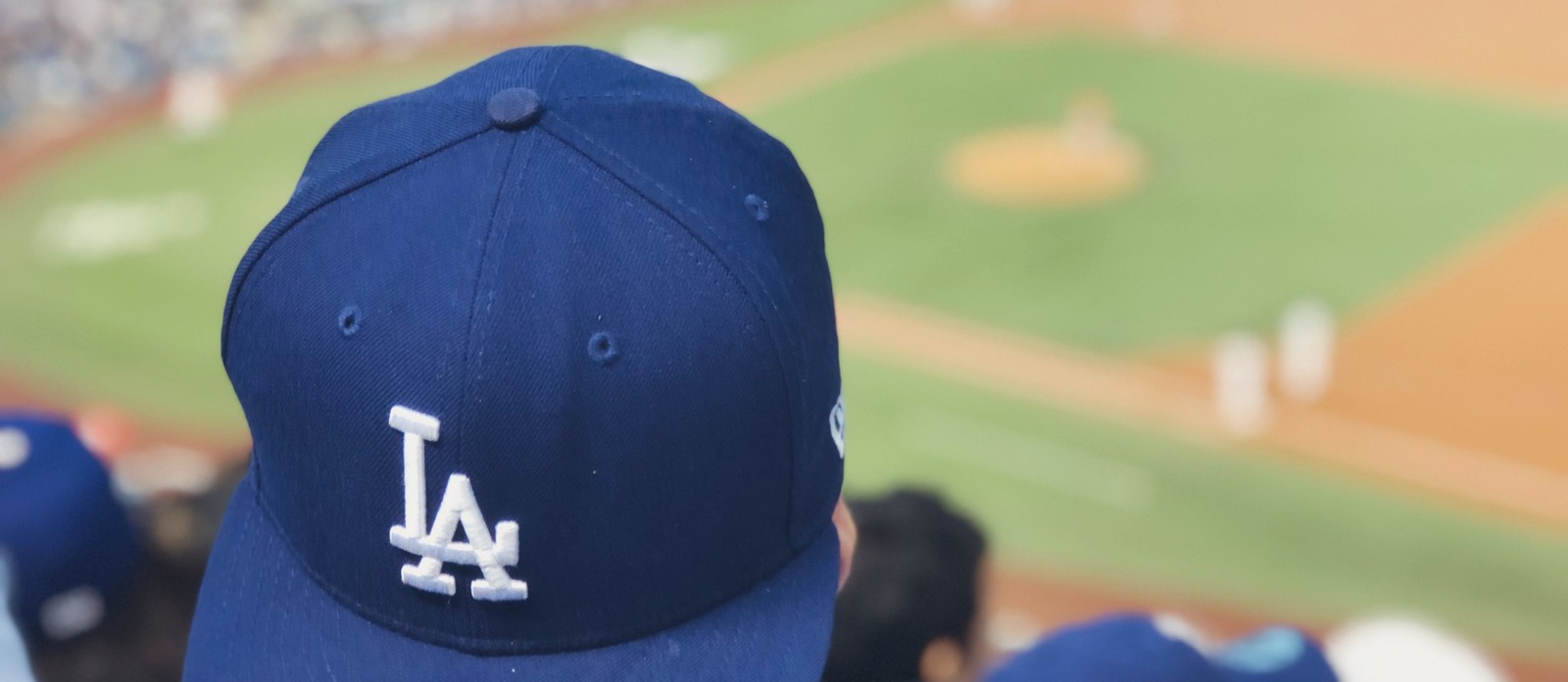 What material were the first baseball caps made of?