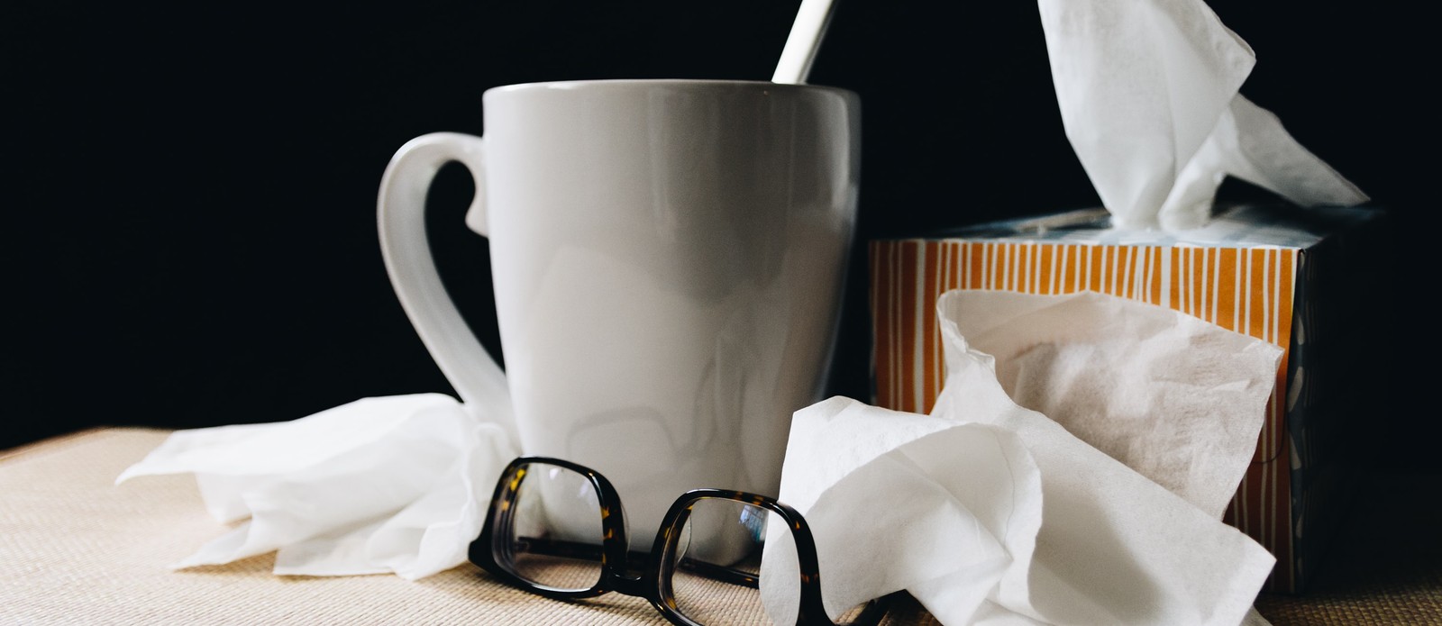 Kleenex Tissues were initially invented to clean what?