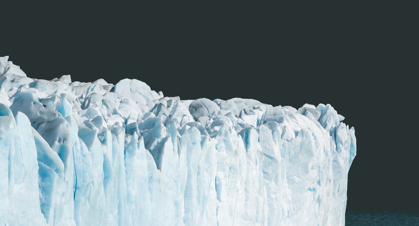 What percentage of Earth's land surface is covered with glacial ice?