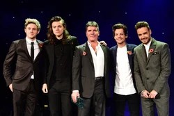 The x factor judge, who put the successful boy band together, told reporters that he gets the hint that some of the guys don't. Simon Cowell One Direction Wiki Fandom