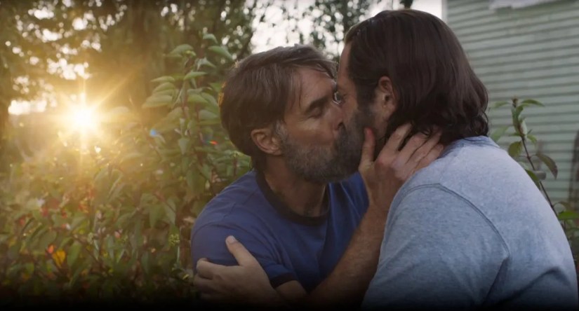 Nick Offerman as Bill and Murray Bartlett as Frank kissing in the garden in HBO’s The Last of Us