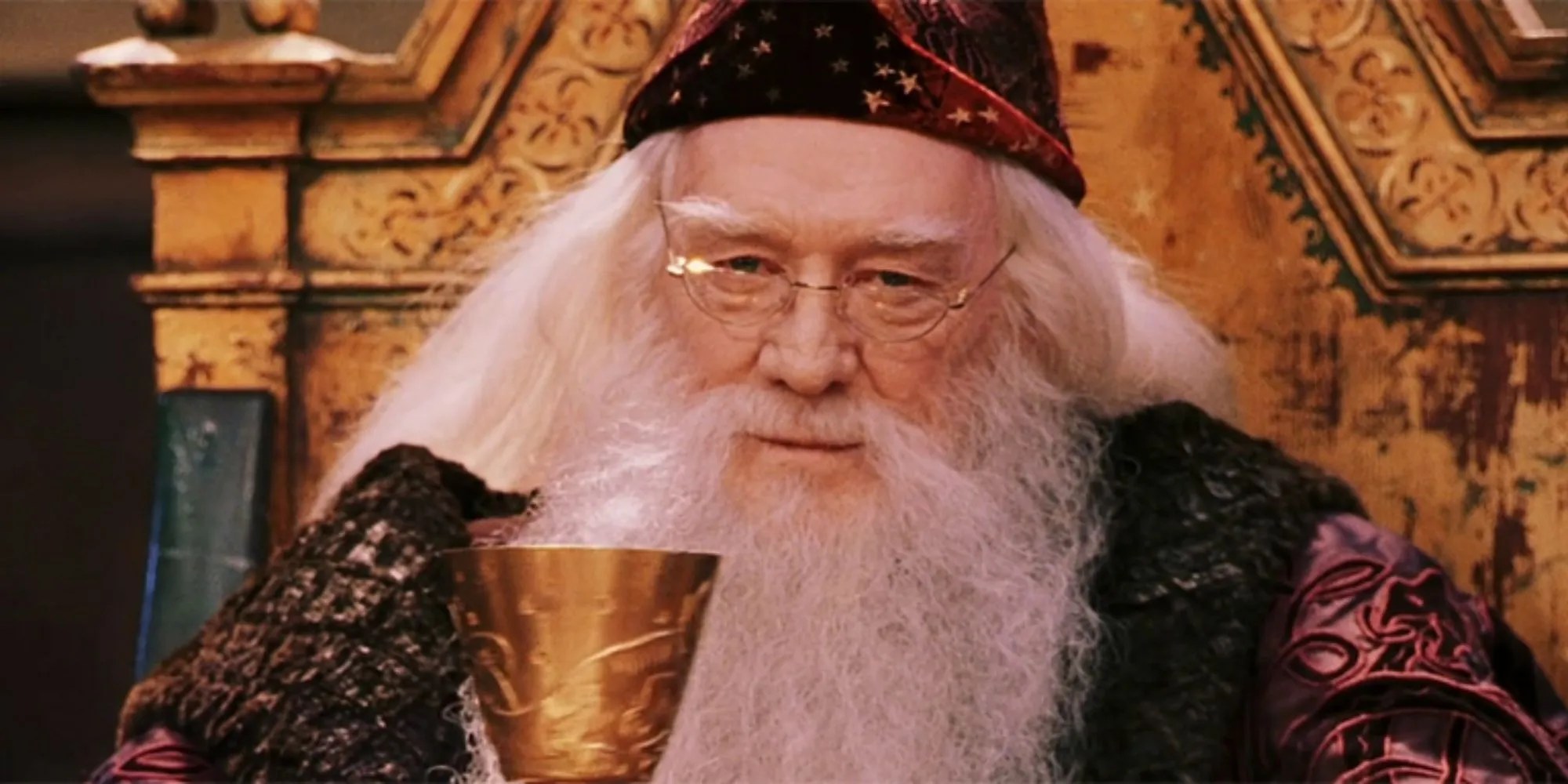 Richard Harris as Professor Albus Dumbledore holding a goblet in Harry Potter and the Sorcerer&rsquo;s Stone (2001)