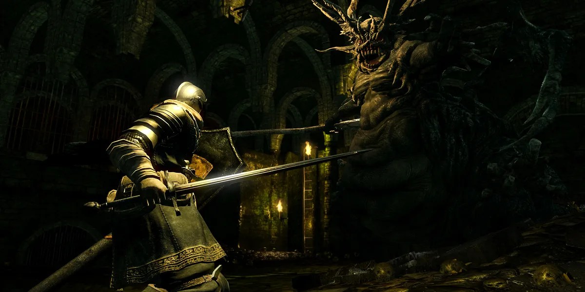 The player fighting the stray demon in dark souls