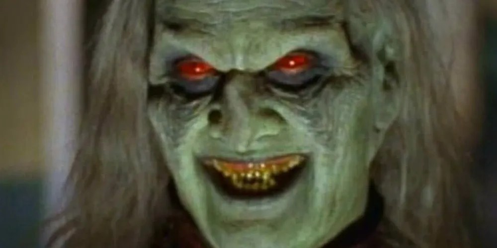 Sea Foam Green colored Vampire with tomato red eyes, slime-green teeth, and long gray hair.