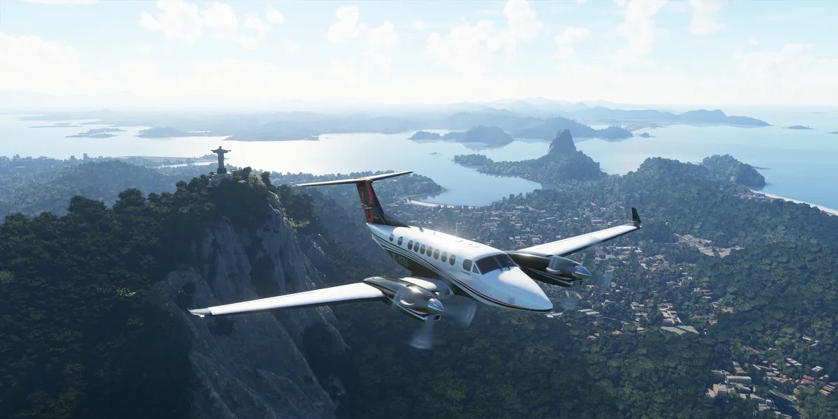 A plane flying in the daytime over Christ The Redeemer