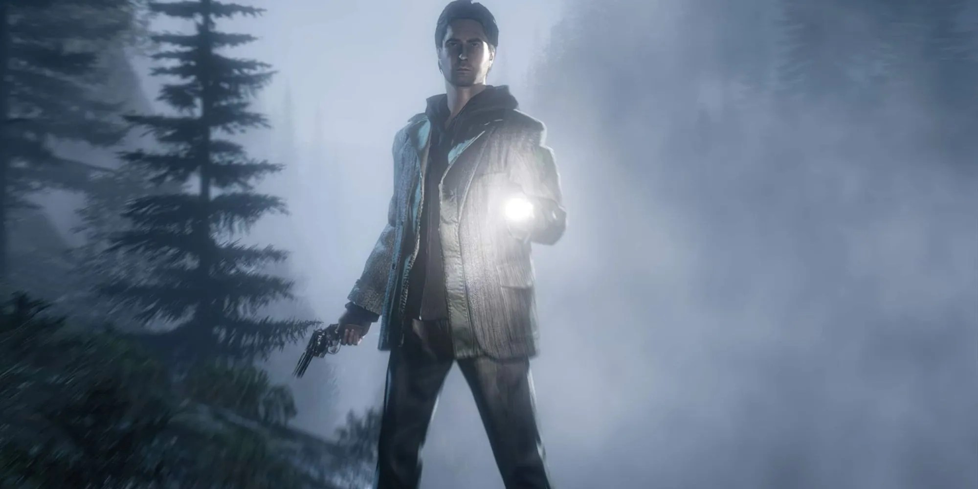 Alan Wake holding a torch and gun