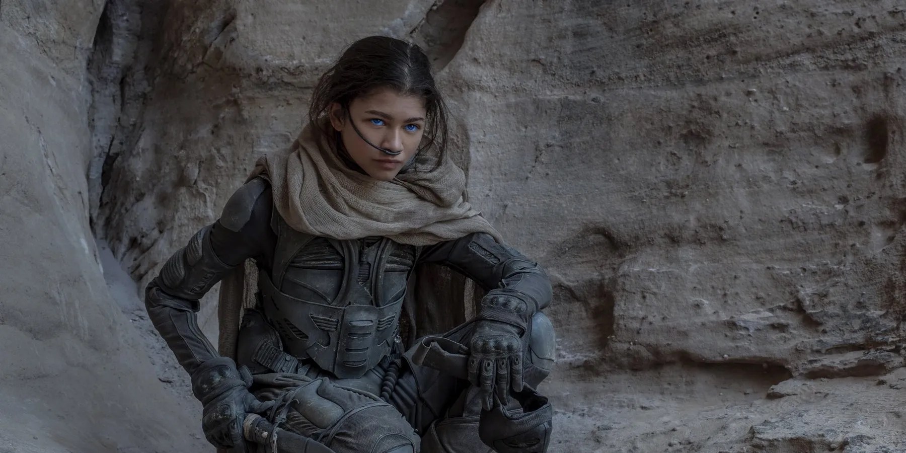 zendaya crouching in desert