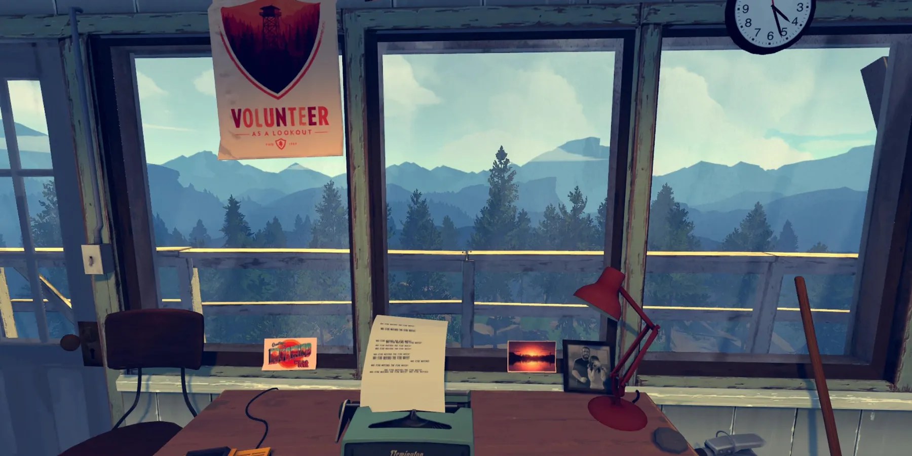 the inside of a tall, watchtower with a typewriter on a desk, postcards on the windowsill, and a volunteer posted with a watchtower pictured inside a shield outline. trees and mountains can be seen outside the windows
