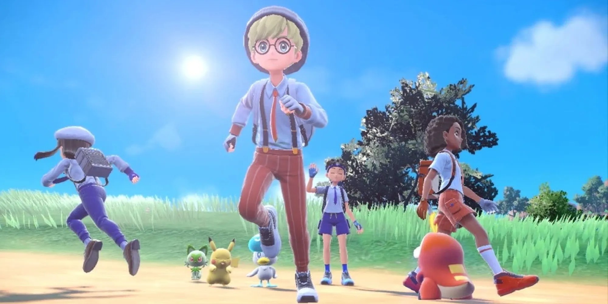 Four players splitting off in an open field with Pikachu, Sprigatito, Quaxly, and Fuecoco in Scarlet &amp; Violet