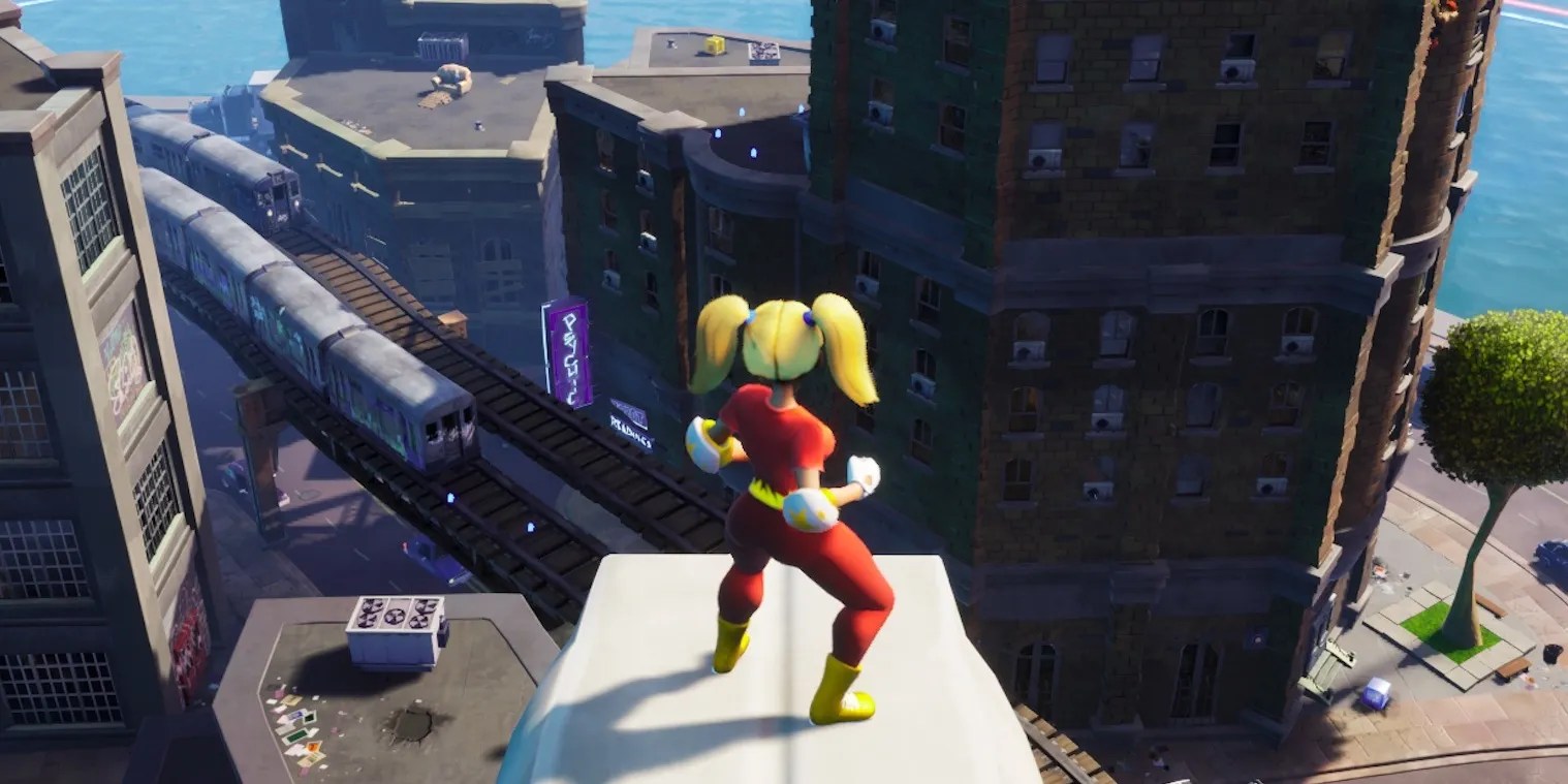 rumbleverse player looking at a subway with a buildings around them