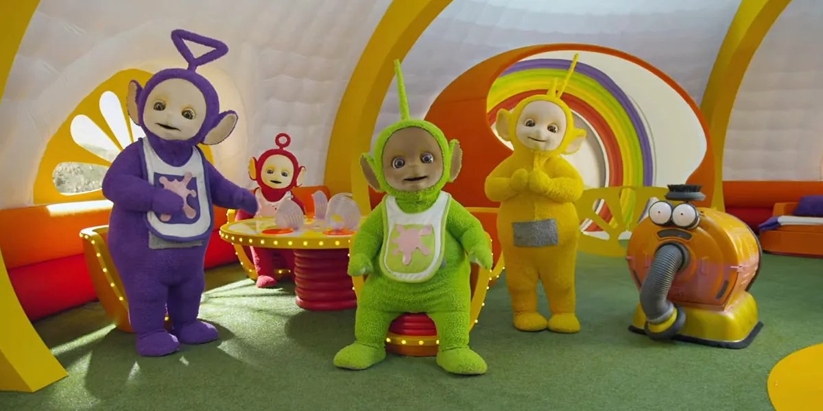 Teletubbies inside their house with spilled Tubby Custard