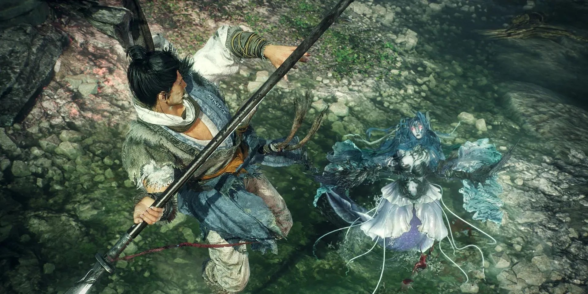 A martial art artist performing Antelope Horn while holding a spear