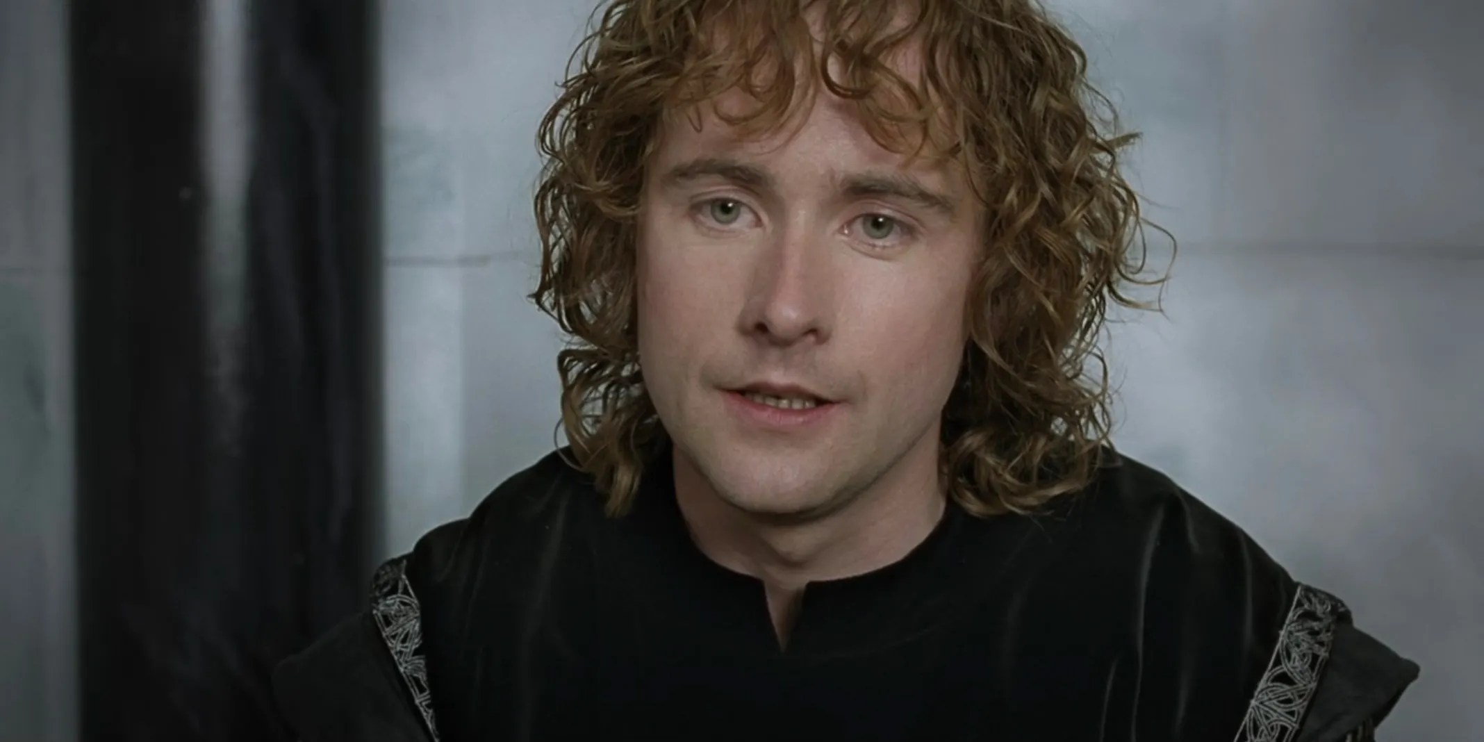 Pippin wearing black and looking sad in The Lord of the Rings: The Return of the King