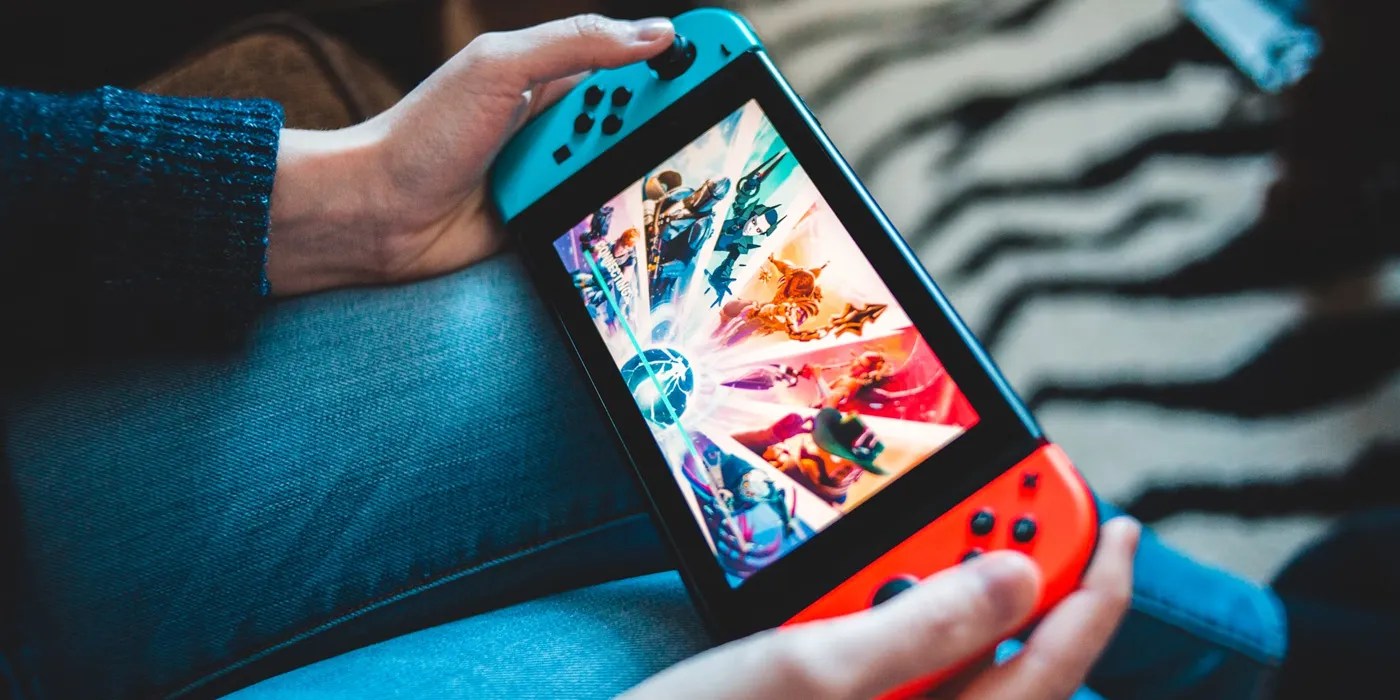 Nintendo Switch in Hand - Erik Mclean