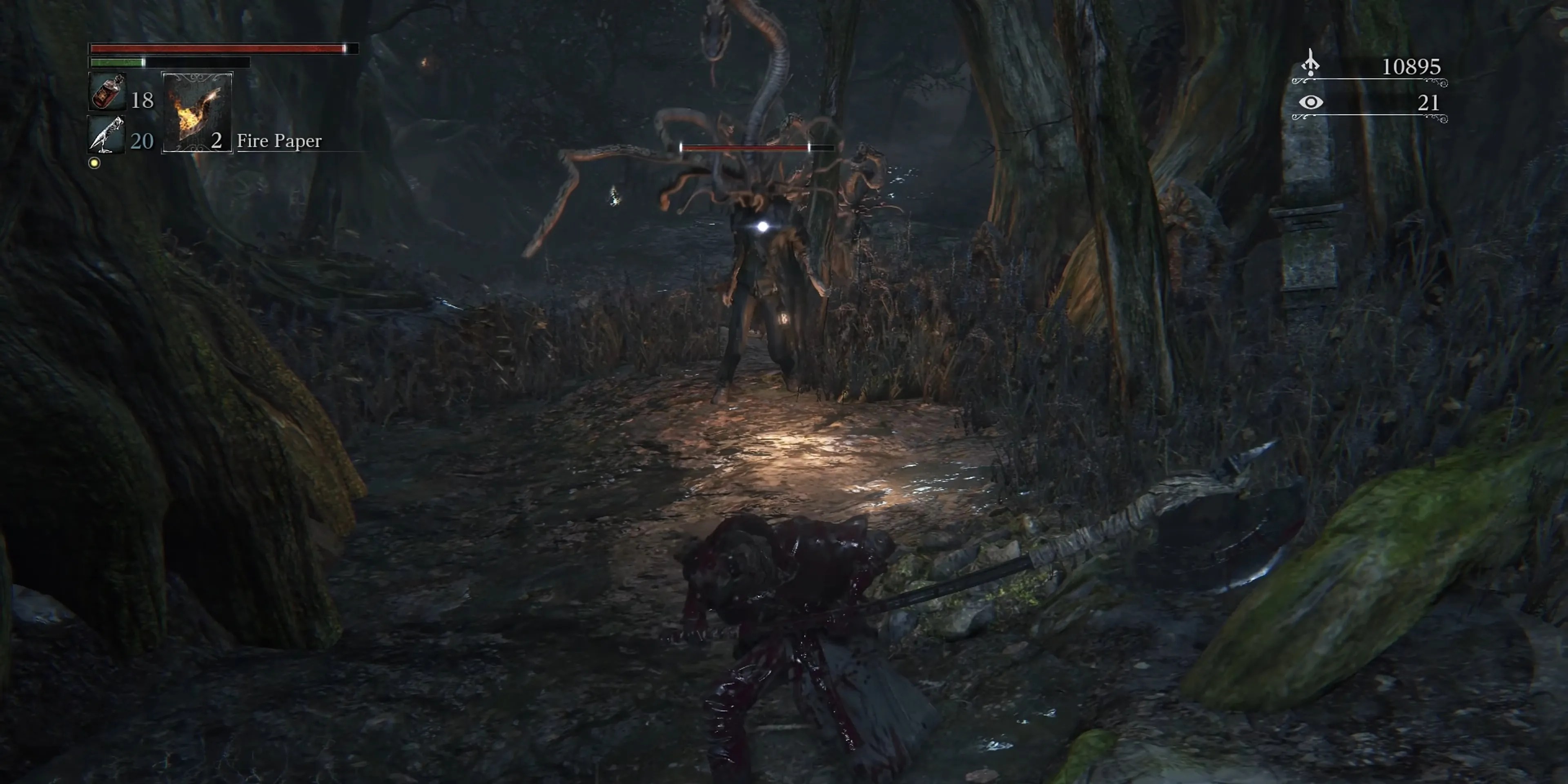 Character fighting a field boss in Bloodborne