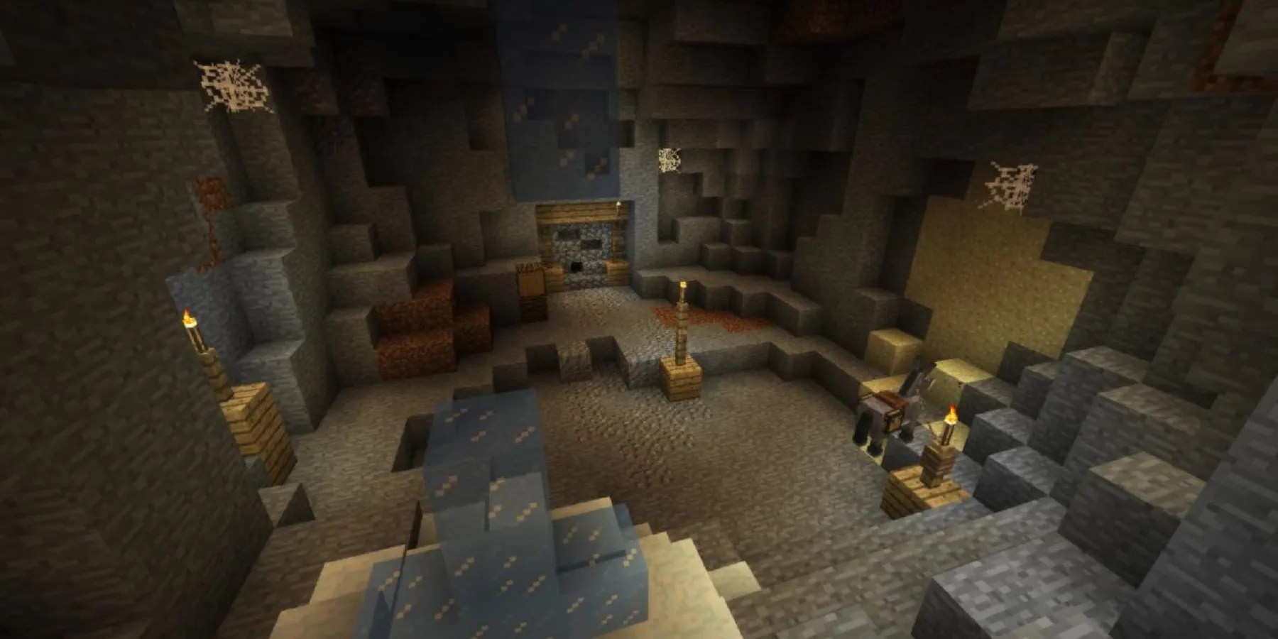 snippet of map Underground 2 with torches, a donkey, and some posts