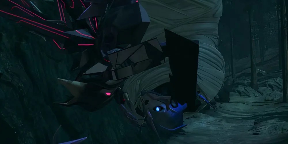 Airachnid threatens Arcee, dangling upside down. Source: Transformers Official YouTube