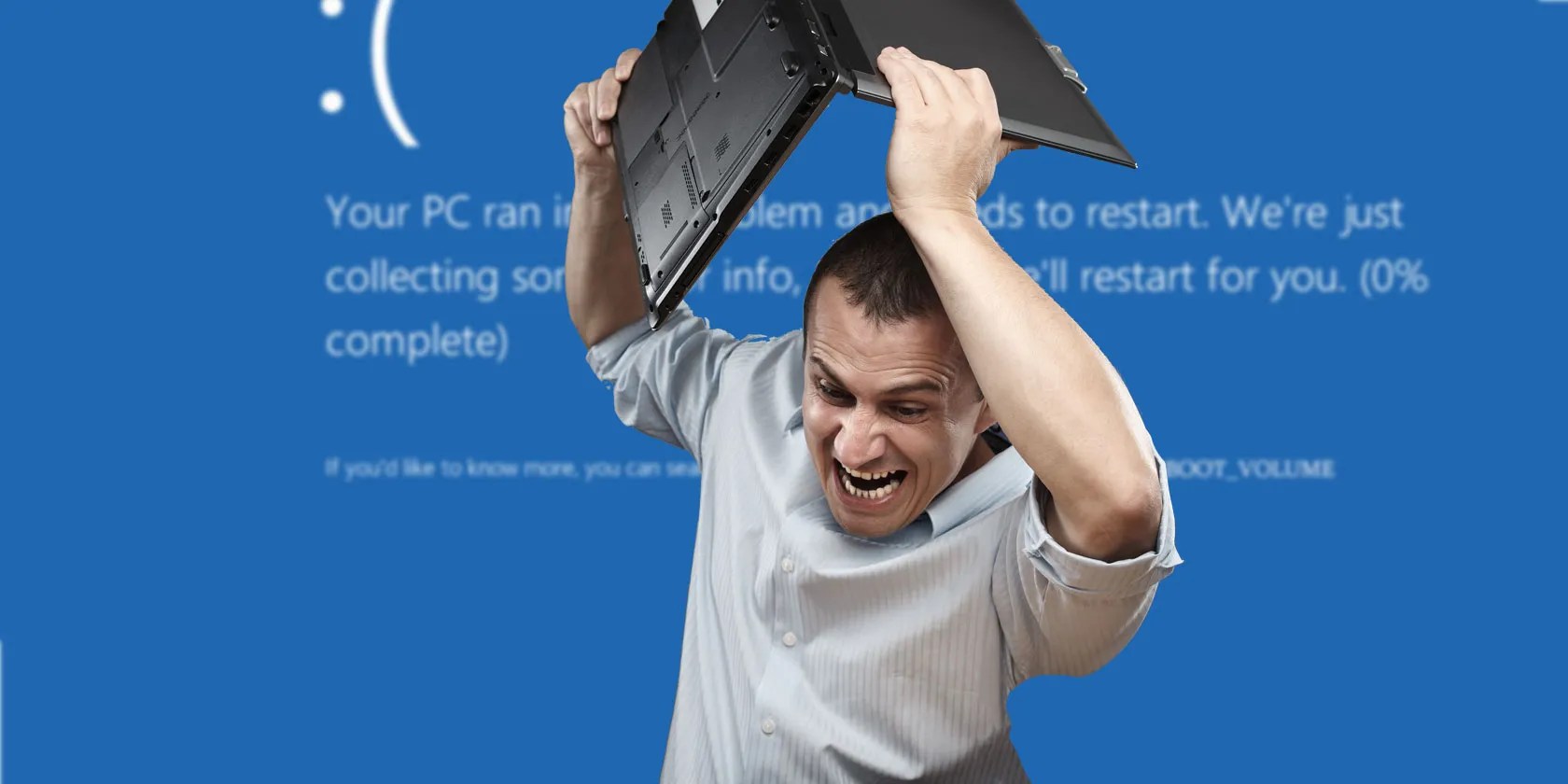 Man about to throw laptop with a background of Windows blue screen of death error
