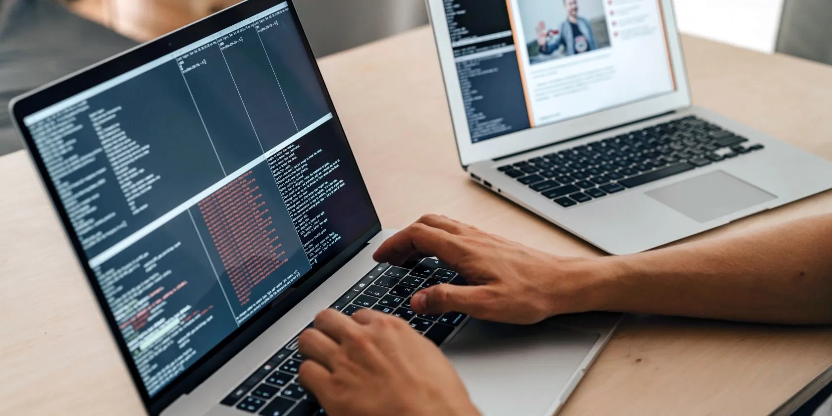 Hands on keyboard working on programming