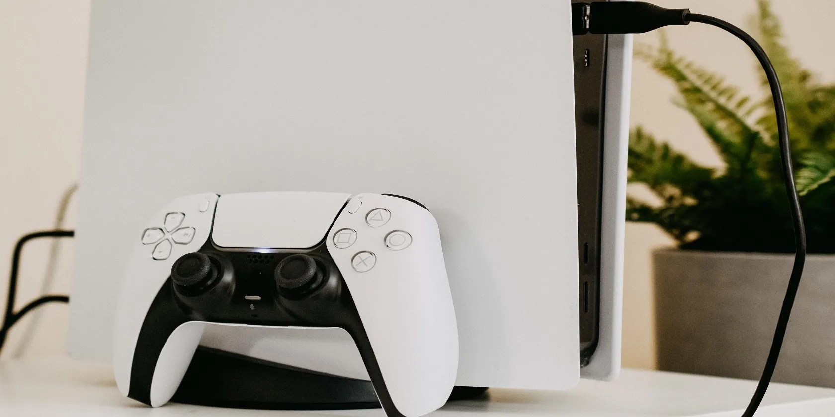 White PS5 Console with one controller and charging cable