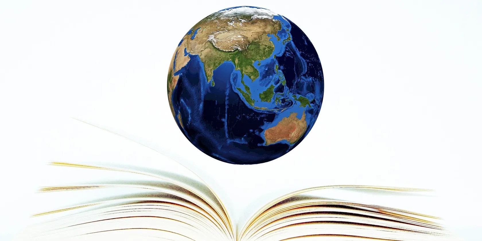 Open book with planet earth hovering above.