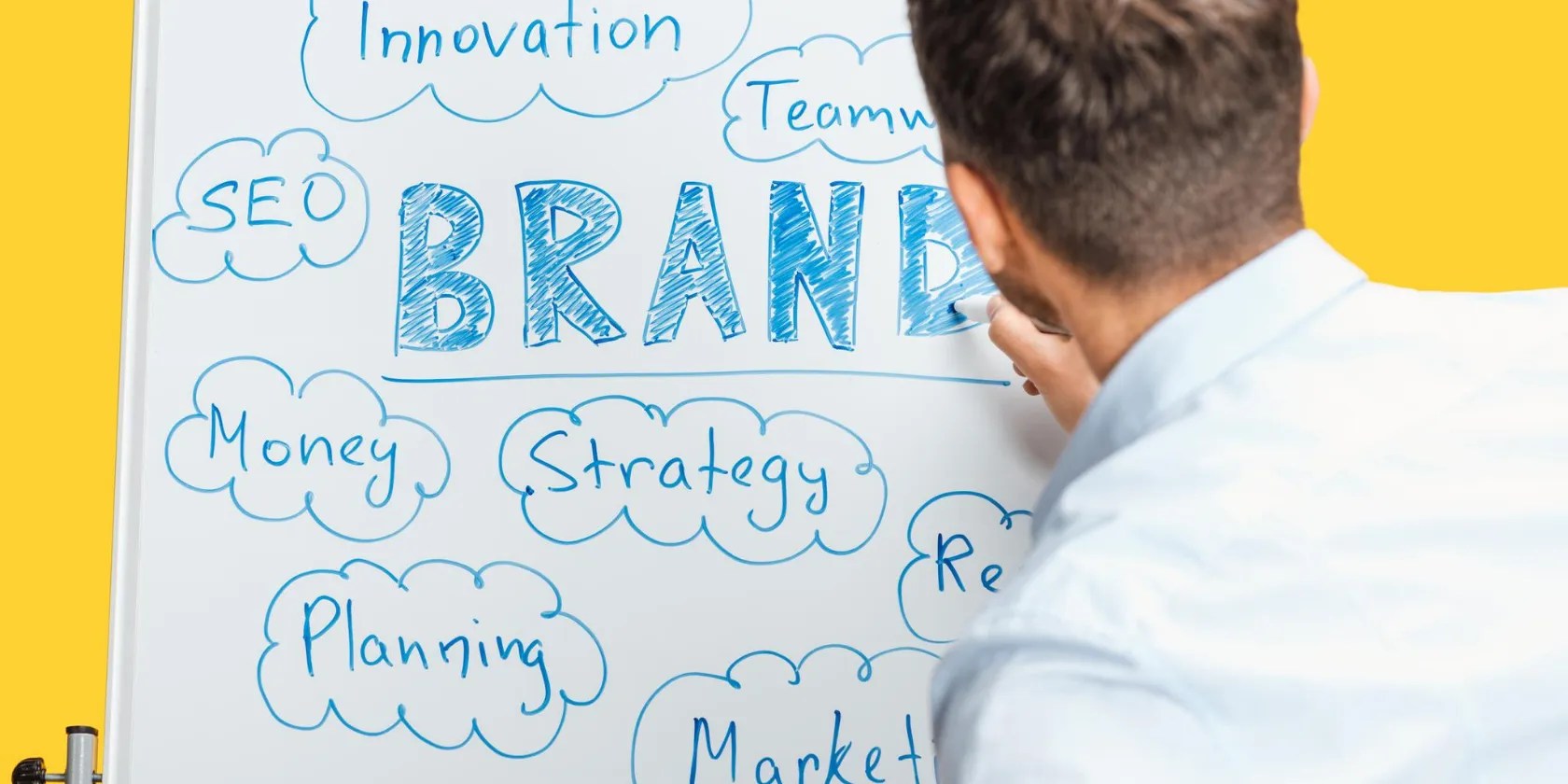 An image showing someone working on a whiteboard