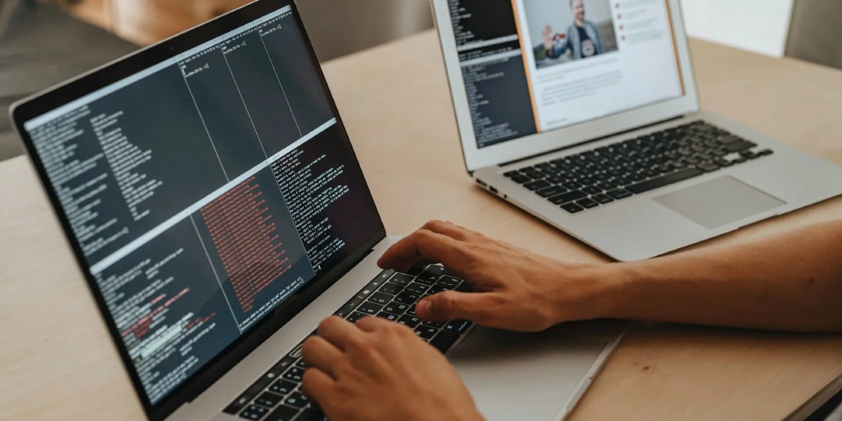 Person coding on a laptop
