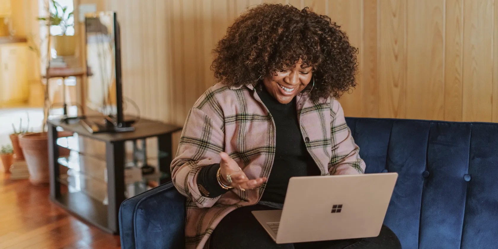 A woman speaking into a Microsoft surface device