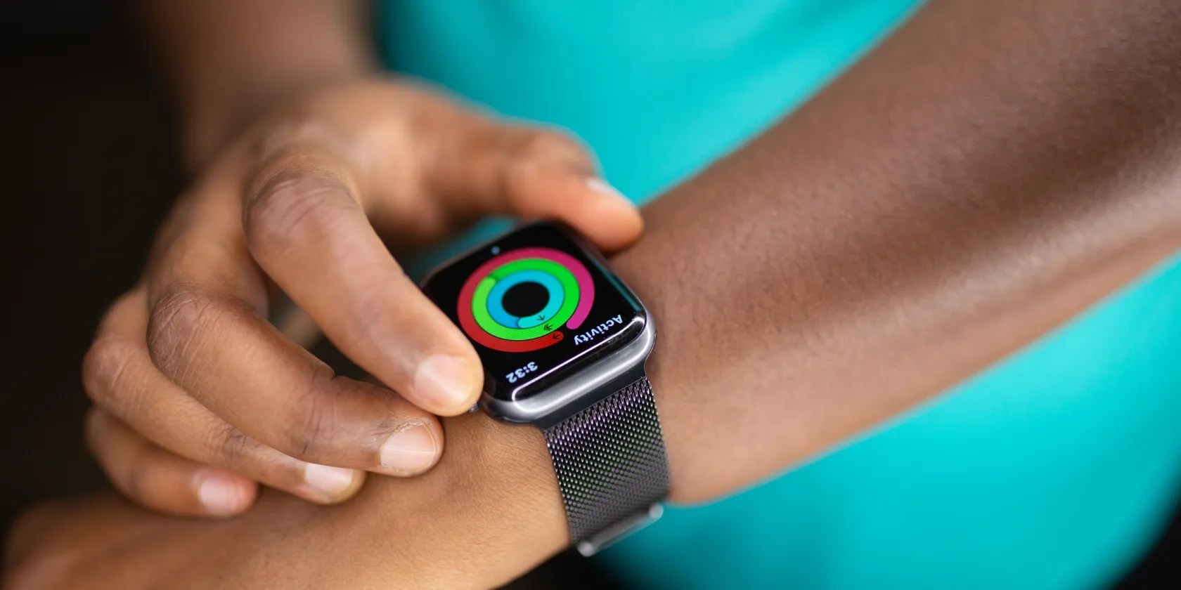 Smart watch with fitness rings on a person&rsquo;s arm
