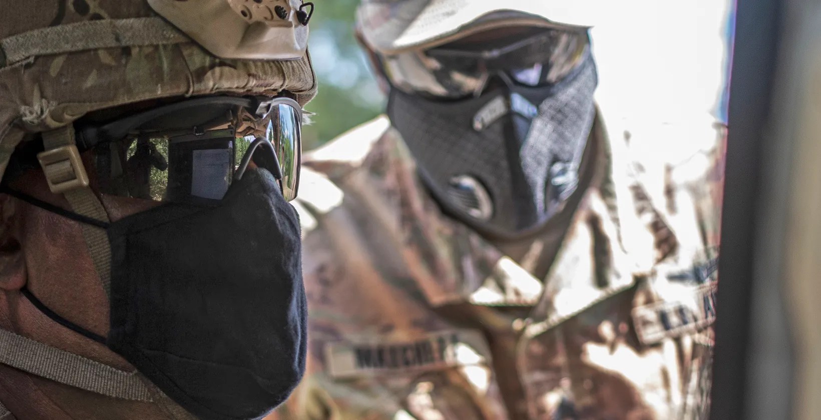 US Army Cyber soldier inside vehicle looking at laptop
