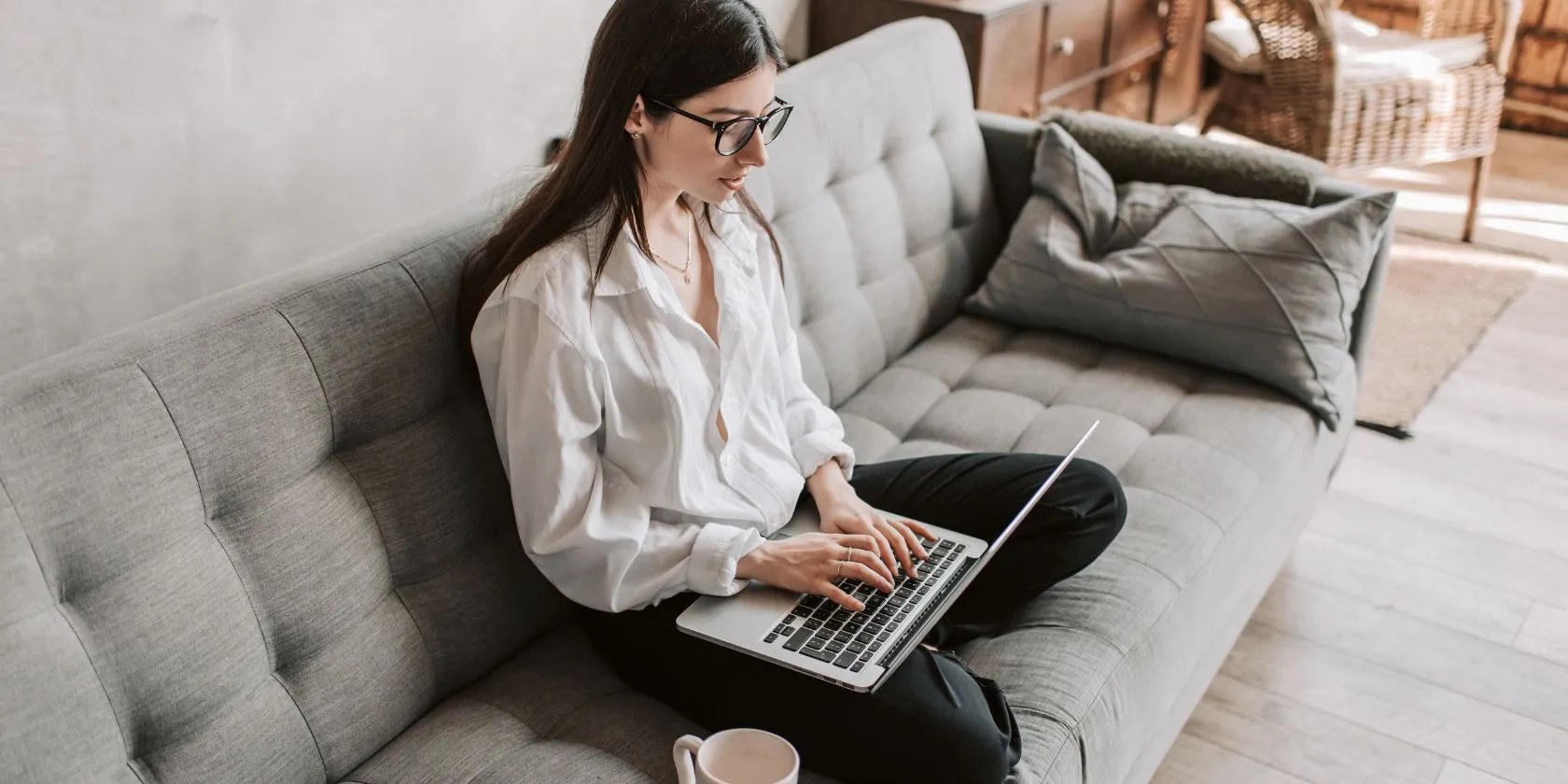 Woman Working At Home Using Laptop