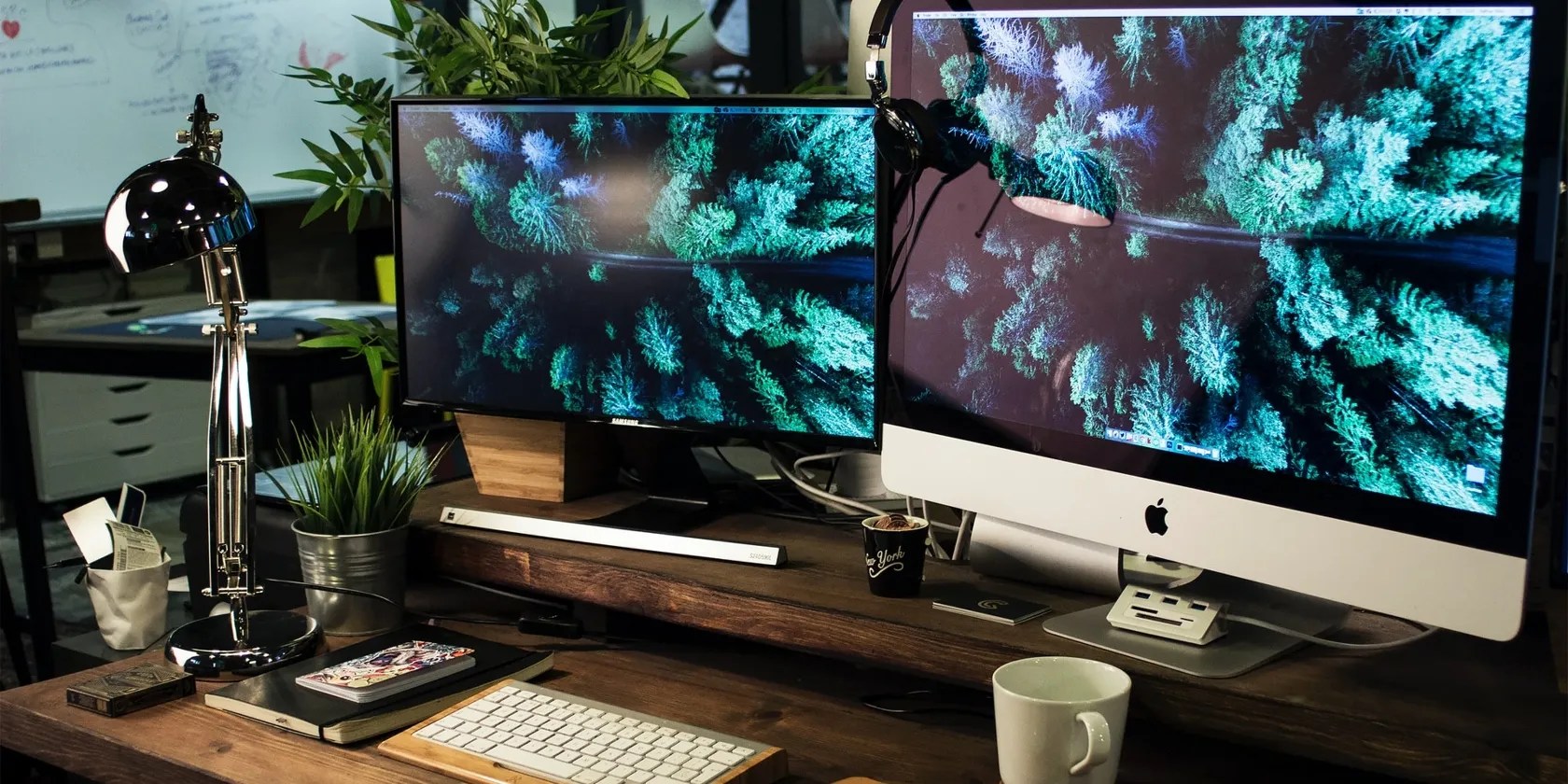 iMac on desk with extra display and other items