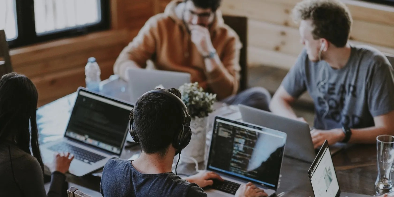 tech team working on laptops