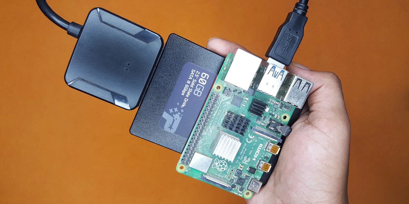 Photo of a Raspberry Pi 4 with USB to SATA adapter and an SSD