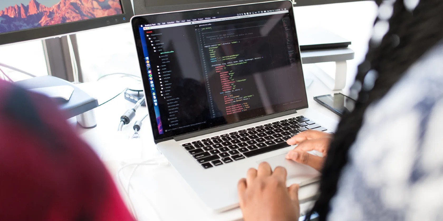 People working on a laptop