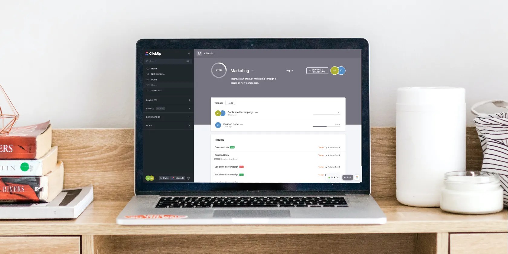 Computer with project management software on display