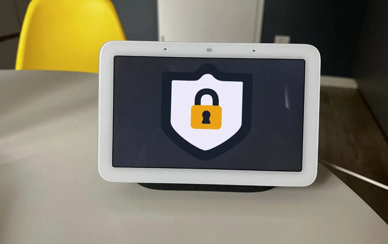 Google Nest Hub on table with lock sign on display