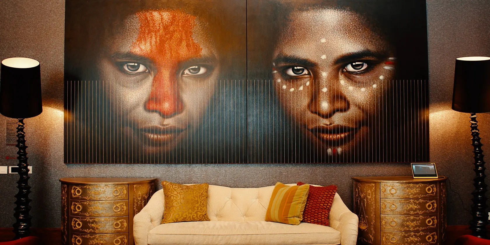 A photo of a colorful painting hanging on a wall