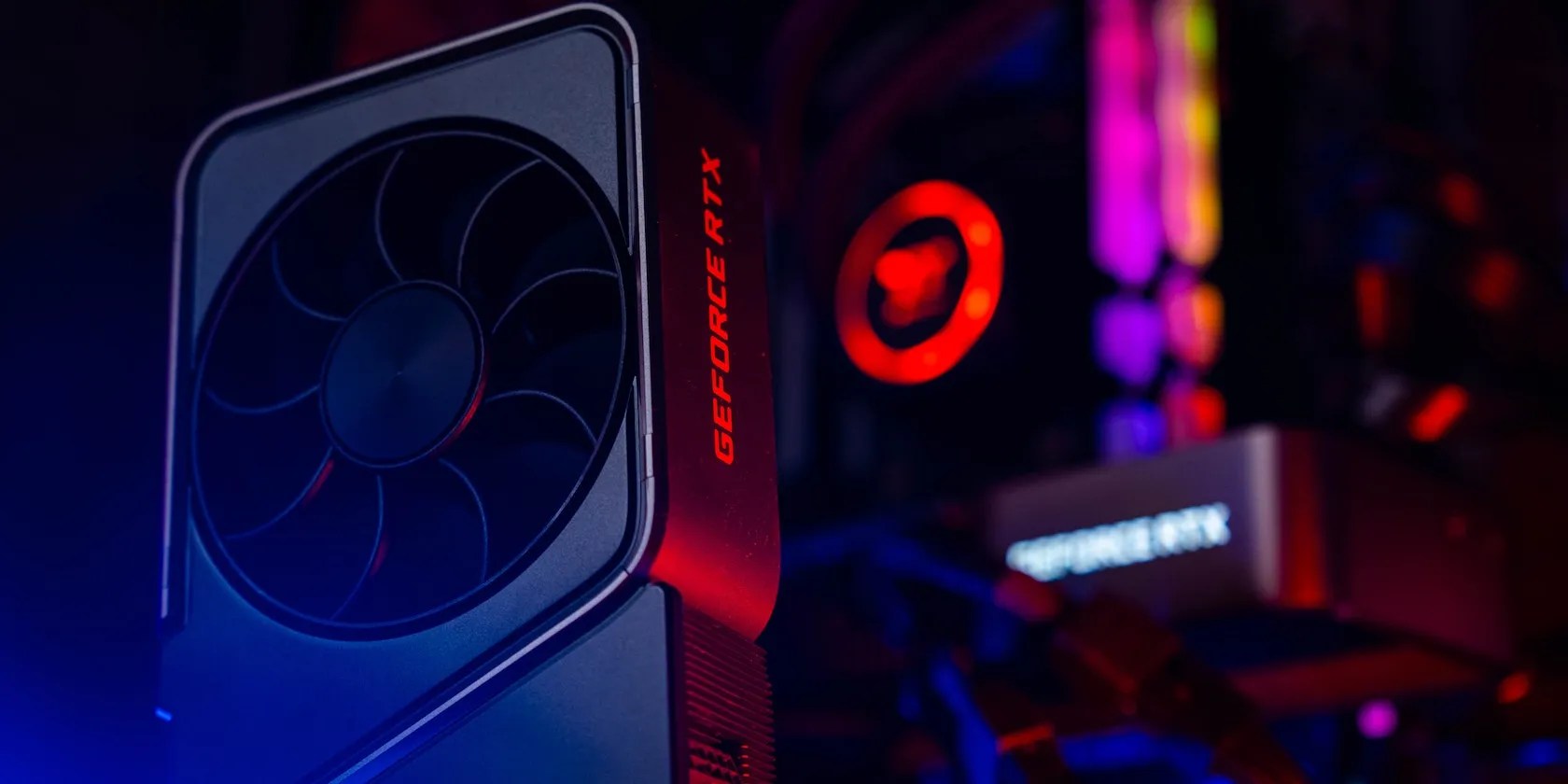 A GeForce RTX GPU standing in front of a PC