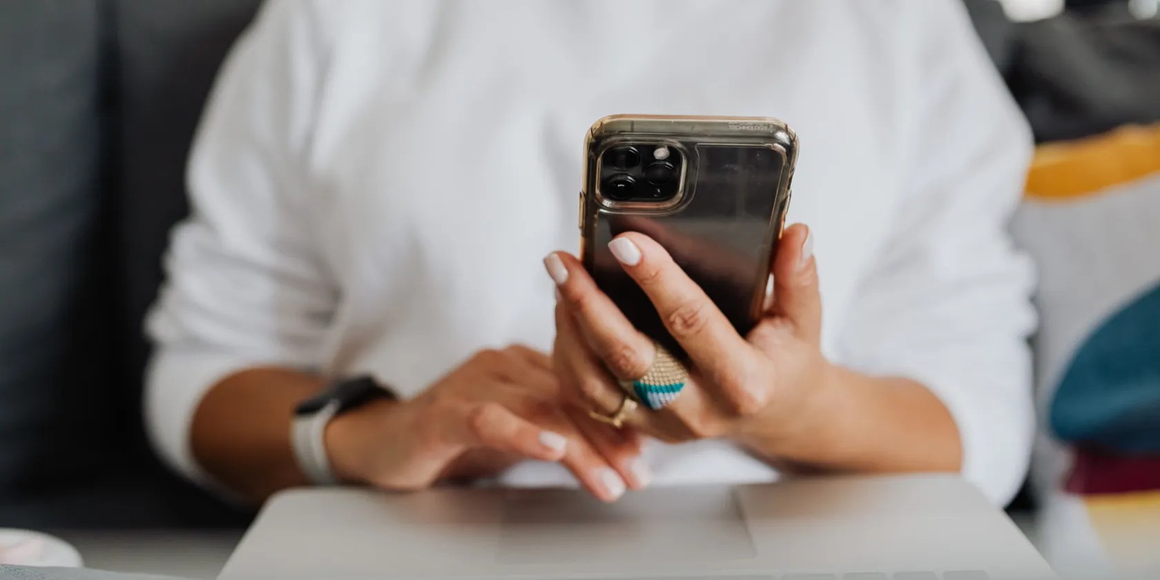 A woman holding her iPhone.