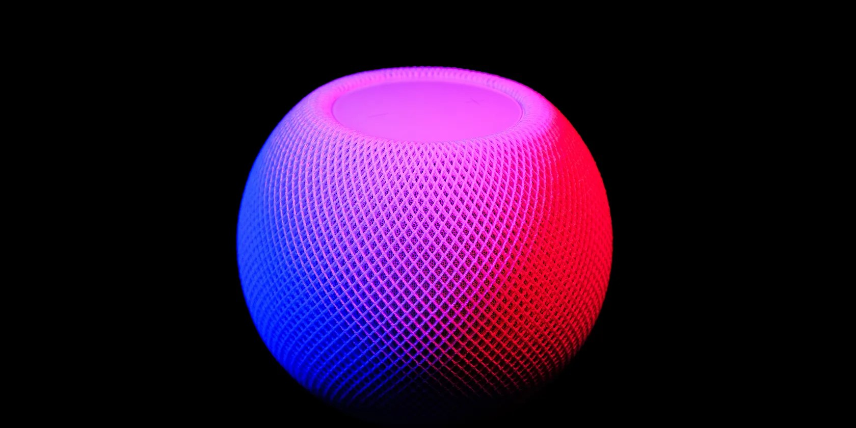 HomePod mini on dark background