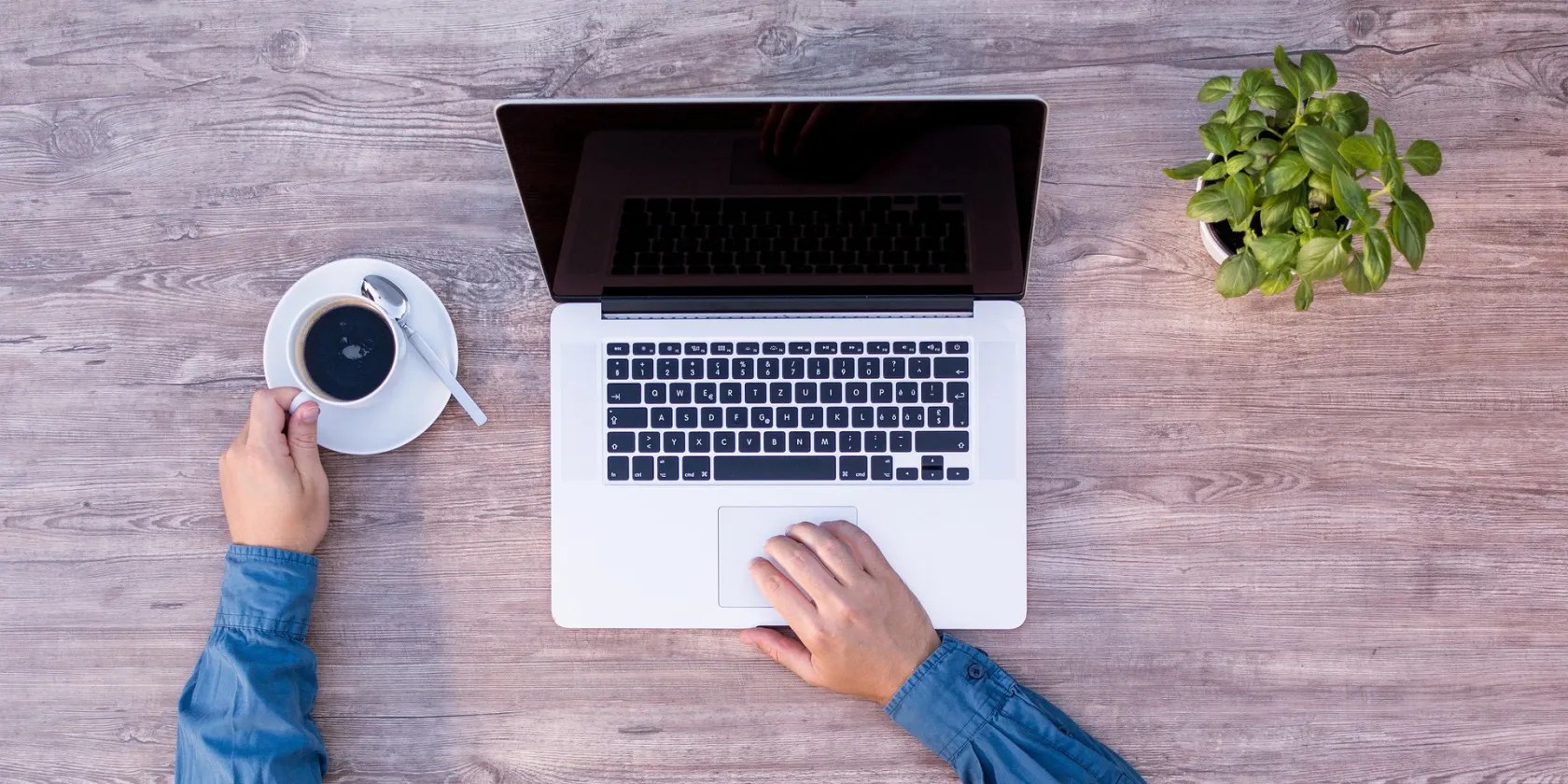 A person using a computer that has a blank screen
